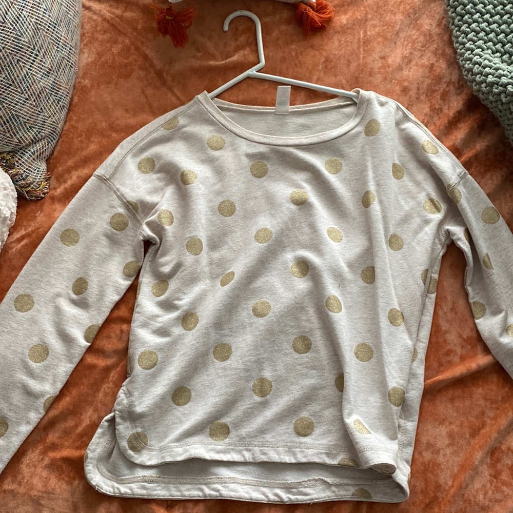 Cream top with gold poka dots